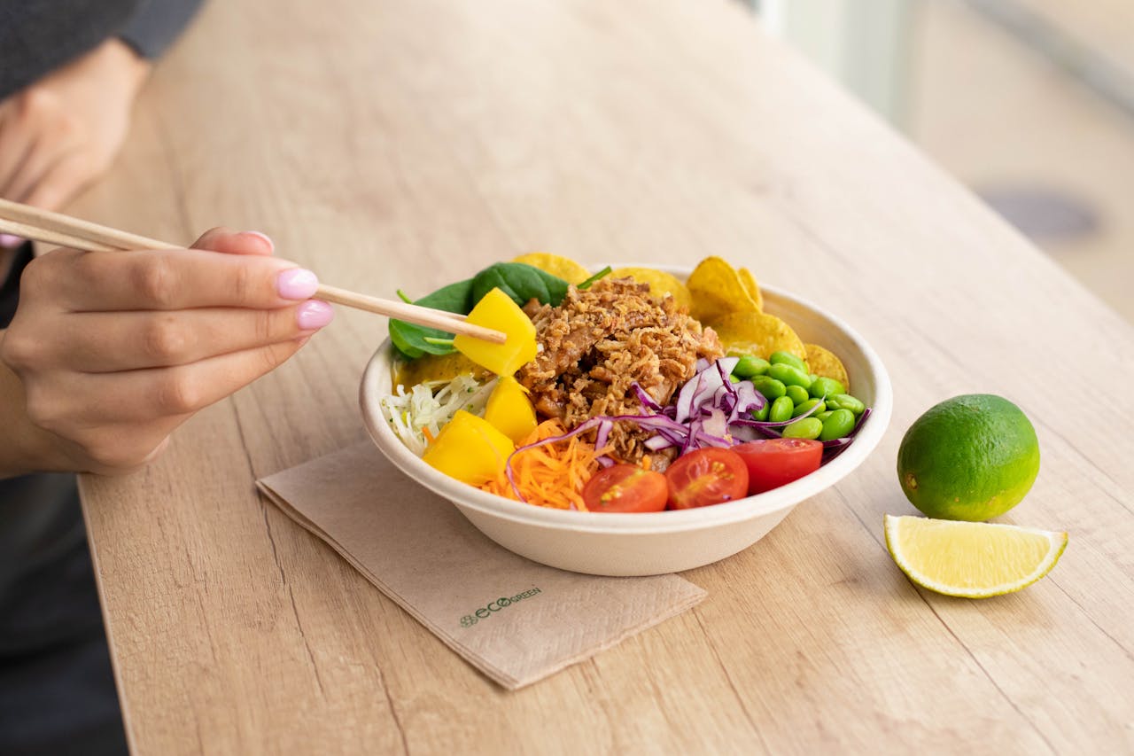 Vibrant vegan salad with fresh vegetables and lime, perfect for a nutritious meal.